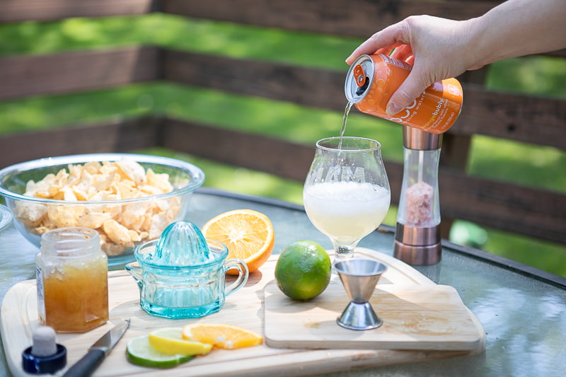 Seltzer pouring into a glass.