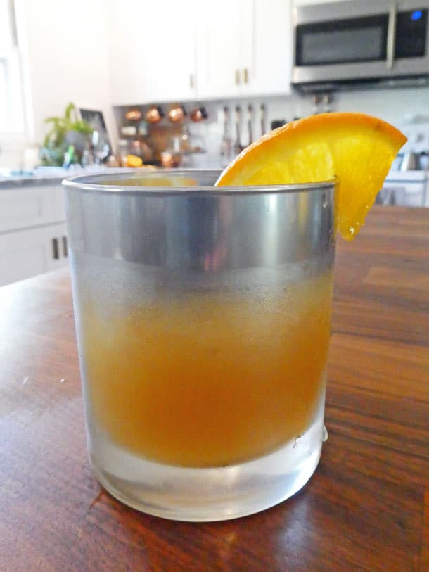 cocktail with orange garnish
