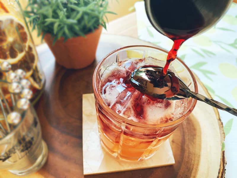 Red wine pouring into glass