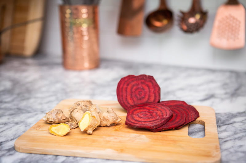 beets and ginger on cutting board