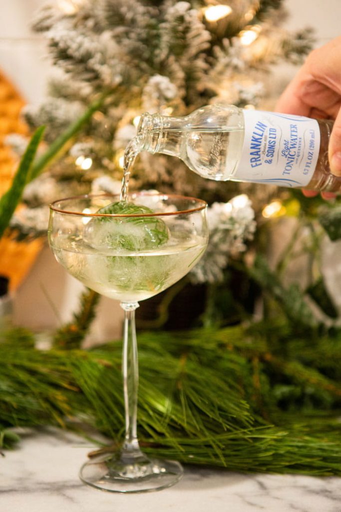 tonic pouring into a glass