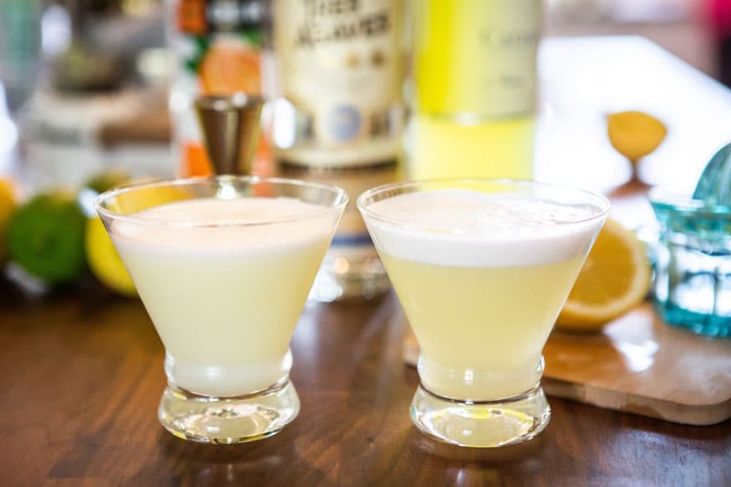Two tequila sours with dry shake on the left and reverse dry shake on the right.