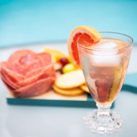 Spritz and snacks by the pool.
