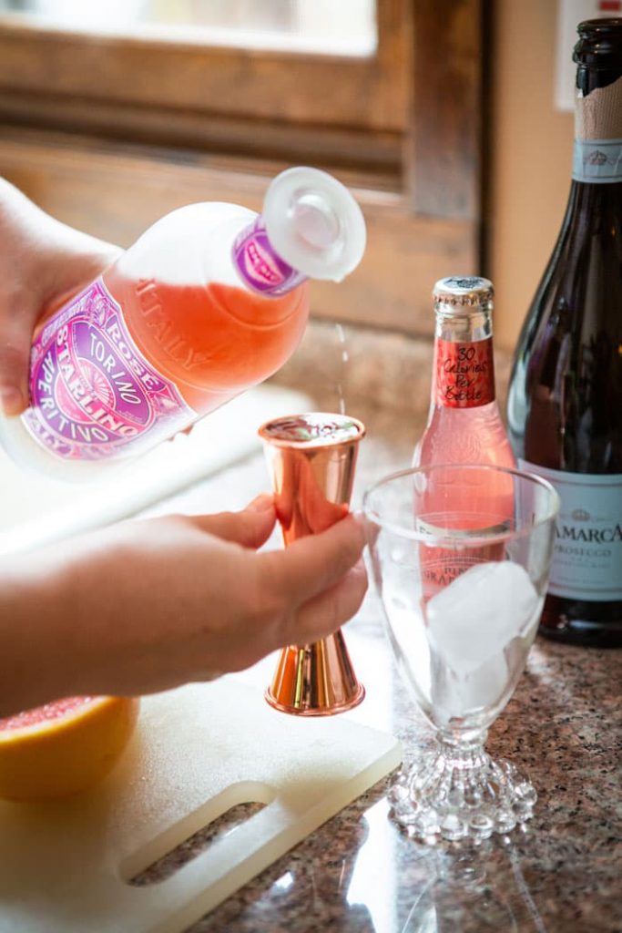 aperitivo being poured into a jigger